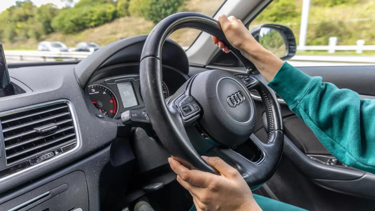 Close-up of a women driving a Audi 4x4 car