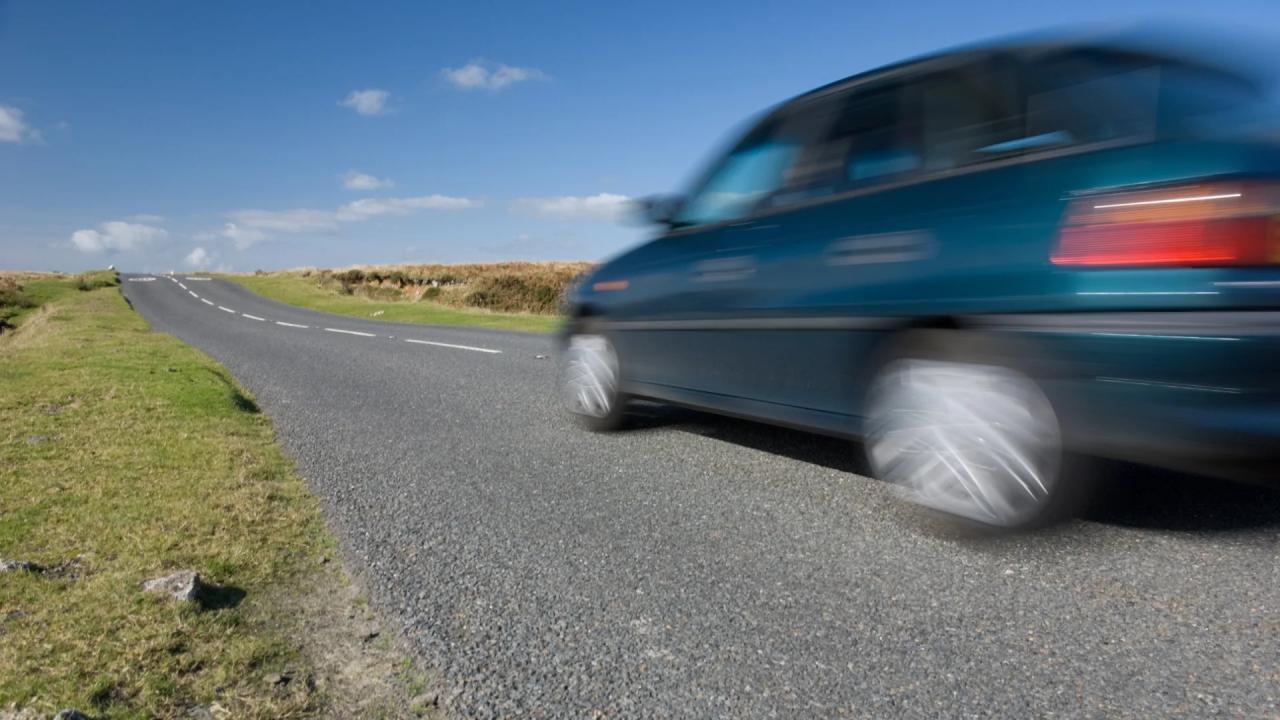 Car driving along a country road