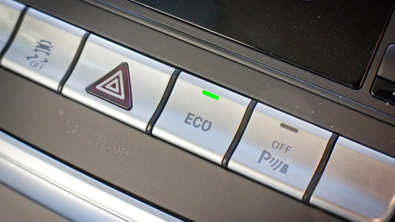 Close-up of the ECO button enabled in a car
