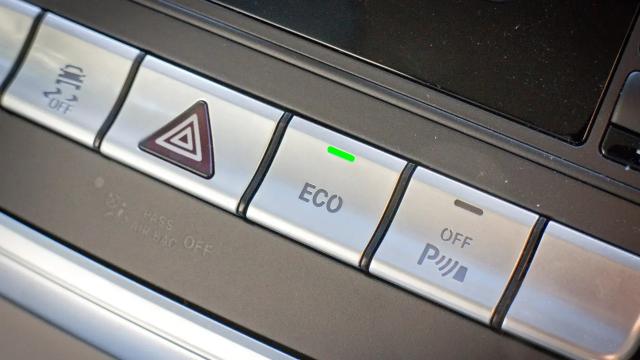 Close-up of the ECO button enabled in a car
